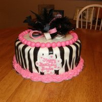 Zebra Birthday Cake 10" Cake covered with white fondant. Zerbra stripes are made of fondant as are the pink pearls. The bow is made of gum paste and the...