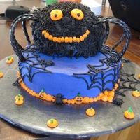 Spider Cake This cake was done for a Halloween birthday party. Dark Chocolate cake on bottom. Spider is a spice cake. All Buttercream. This cake gave...