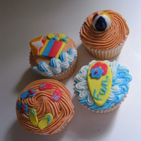 Summer Time Cupcakes! I used my Cricut Cake for the umbrellas, flip flops, flowers and surf board.
