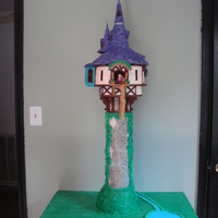Tangled Tower I made this cake for my daughter's 4th Birthday. Everything is covered in fondant, but the only parts that are edible are the 10&quot...
