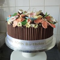 Daughters' 40Th Birthday Cake Entirely edible apart from diamonte "40", ribbon and cakeboard. Chocolate cake inside sandwiched with chocolate butter cream and...