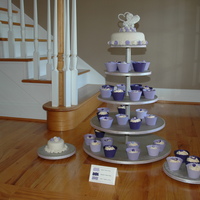 Cupcake Wedding This is my first wedding order. The bride wanted a cupcake wedding with an 8" tier on top. I made a small 4" for them to cut. The...