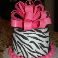 Pink Zebra This is a birthday cake for a friend of my daughters. She requested a zebra cake with a big pink bow:)