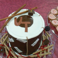 Graduation Cake For Music Lovers The graduate loves playing the Dhol - an Indian Drum - so we created it with cake and put the names of all the schools he's attending...