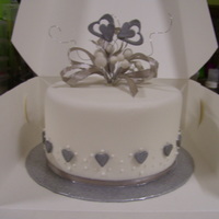 Cutting Cake This is the cutting cake the bride and groom wanted cupcakes to match, it was chocolate cake with buttercream covered in fondant hand made...