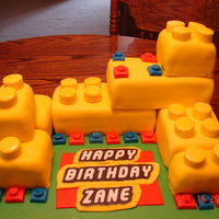 Lego Cake This was my first attempt at a Lego cake. The boy that it was for, wanted all yellow Legos. I used 2-13x9 pans and cut the blocks to size....