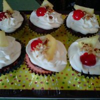 Banana Split Cupcakes Banana Split Cupcakes. Strawberry cake with banana pudding center dipped in chocolate ganache, whipped cream icing with cherry, pineapple...