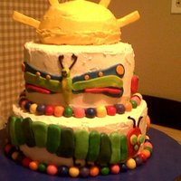 Very Hungry Caterpillar 1St Birthday sunshine is funfetti cake, middle is chocolate cake peanut butter filling, bottom layer yellow cake raspberry filling. all done in...