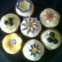 Lemon-Blueberry Lemon filled Blueberry Pound cupcakes with cream cheese icing. Some topped with dusted fondant flowers other with lemon peel and...