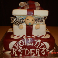 Baby Gift Box Alabama Style Baby shower cake for an avid Alabama fan. Chocolate cake covered in fondant.