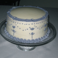 Anniversary Cake Torted 2 layer white cake with alternating fillings of raspberry and lemon. Vanilla buttercream icing.