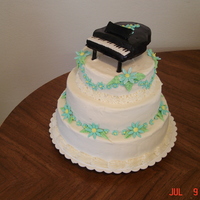 Piano Teachers Cake Flowers and piano are fondant