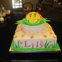 Lily's 1St Birthday Cake This was a birthday cake for a very good friends daughter's 1st birthday. It is BC except for the grass going up the cake, lady bug...