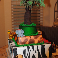 Safari Cake I made this safari cake for my daughter birthday. The tree on top is made of modeling chocolate with royal icings piped for the leaves. I...