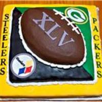 Super Bowl Xlv. Bottom layer is 14x14 dark chocolate with marshmallow fudge buttercream filling and chocolate buttercream icing under fondant. Middle layer...