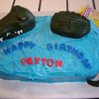 Peys Alligator chocolate cake with rolled fondant alligator. Pound cake was sculpted to the shape of the body then covered in fondant and imprinted with&...