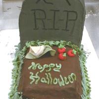 Tombstone Cake The tombstone itself is layered almond cake with dark chocolate ganache. It is frosted with milk chocolate buttercream. The grave is...