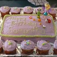 Tinkerbell Cake And Cupcakes Tinkerbell Cake and Cupcakes with toys.