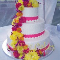 Three Tiered Wedding Cake With Fresh Flowers Three tiered wedding cake with fresh flowers in pink, yellow and orange - my favorite color combination! It was a perfect day for an...