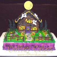 Haunted House This is a 9x13 and the Wilton stand up house pan. Everything is buttercream except for the fence of course and the moon which I just cut...