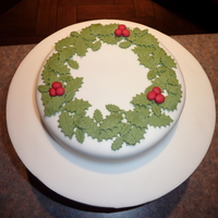 Holly Wreath Christmas Cake My boyfriends parents asked me to decorate their Christmas cake for them and this was the end result.