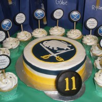 Buffalo Sabres Hockey Made for my nephew's 11th birthday. 8" cake iced in buttercream with fondant accents. Hockey puck is a mini cake covered in...
