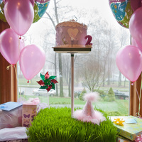 Butterfly Birdhouse Cake Fondant covered cake on top of custom stand with real grass base! The entire cake, including the butterflies are edible.