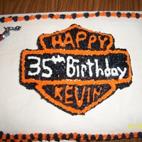 Harley Cake This is a cake I made for my husband's birthday. It is two 9x12 cakes. The top is a 9x12 cake carved in the shape of the harley logo,...
