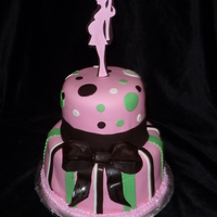 Silhouette Topper Baby Shower Covered In MMF. Cake Decor is Satin Ice fondant (Vanilla and Chocolate). Topper is Gumpaste and Chocolate Fondant. I found a picture of a...