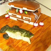 Goin Fishin I made this cake for a groom ! He love fishing and wanted a dock with a tackle box and a fish !! The fish is hand made out of white...