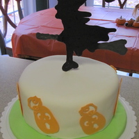 Witch Cake Candy witch. Fondant-covered cake with fondant pumpkins.