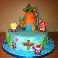 Spongebob Cake I made this for my son's birthday. 12in white cake with cookies and cream buttercream filling and the pineapple was RKT covered with...