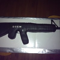 Gun I made this for my nephews birthday. My first "sculpted" cake (out of 12X18 sheet) I should have over scultped it, as I forgot to...