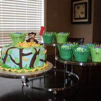 Monkey Cake I did this Monkey Cake for my nephew's 1st birthday. The cupcakes are chocolate with banana icing and I made the cupcake wrappers...