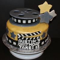 Movie Themed Cake This cake was for a boy turning 13. Even the reel was made out of cake...and I used Wilton Gold Pearl Dust on the cake...its hard to tell...