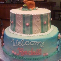 Pooh Baby Shower Cake 12 inch x 9 inch round layer cake. Bottom layer iced in butter cream, top covvered in MMF. Pooh and figures are made from MMF.
