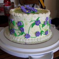 Misc Cake Buttercream frosting ith royal icing flowers.