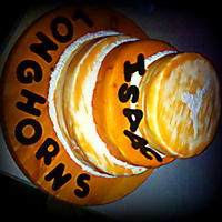 Texas Longhorns 3 tier triple chocolate fudge and orange swirl cake filled with buttercream. Covered in MMF with gumpaste accents. Piped on the Longhorn...