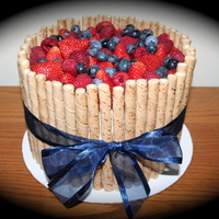 Chocolate Fresh Fruit 4 layer chocolate cake. 2 layers buttercream filling, middle filling is strawberry preserves. Topped with strawberries, raspberries, and...