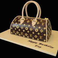 Lv Purse Cake I was very happy with the way my cake turned out.. I added couple of pics of the caving and the ganache process...