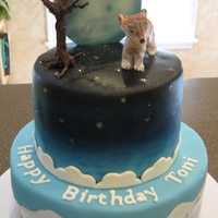 October Birthday Cake This cake was made for my daughter's 22nd birthday. It was inspired by an amazing cake by Kitagrl here on CC. The animal on top was...