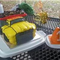 Dump Truck Cake 3 - 11x9 pans, chocolate cake... stacked, cut, and rearranged.buttercream icing. the wheels are miniature bagels and the dirt is made of...