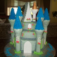 Cinderella Castle Cake Chocolate/vanilla cake with buttercream frosting covered with fondant. My first cake that had a major catastrophe so this is the after...