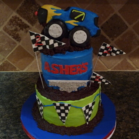 Monster Truck Cake Chocolate cake with chocolate ganache filling. Monster truck in RKT. Fondant and gumpaste decorations. Inspired by Pink Cake Box Monster...