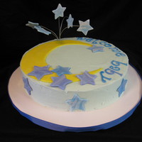 Welcome Baby White cake with raspberry filling. Blue buttercream with 50/50 fondant gumpaste decorations. Sparkled up the stars and moon hard to see in...