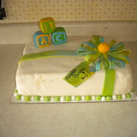 Baby Cake I made for a friends baby shower. Ribbon and bow are fondant, cake is coverd in MMF and the blocks are RKT.