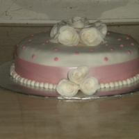 Lovely I made this for my decorating class. Chocolate cake with pb buttercream. Fondant ontop and fondant roses.