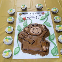Monkey Cake With Banana Cupcakes My daughter's 1st birthday cake. Monkey cake and cupcakes with bananas on them.