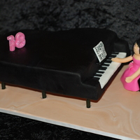 18Th Birthday Piano Cake I did 2 cakes this week both with black fondant - what a nightmare! I hate the stuff! You need an engineering degree to do some of these...