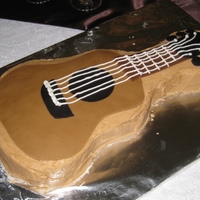 Guitar Grooms Cake Red velvet with cream cheese buttercream and fondant decorations.